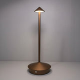 Brown weatherproof LED table lamp set on a patio at dusk