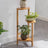 Bamboo corner stand holding plants near window – 3 tier bamboo plant stand