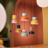 Six pendant colourways grouped on a terracotta arch banner