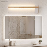 Slim wood vanity light above a wide rectangular lit mirror