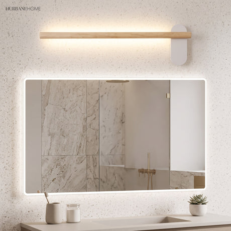 Slim wood vanity light above a wide rectangular lit mirror