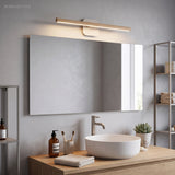 Slim wood vanity light above a wide mirror and a timber vanity
