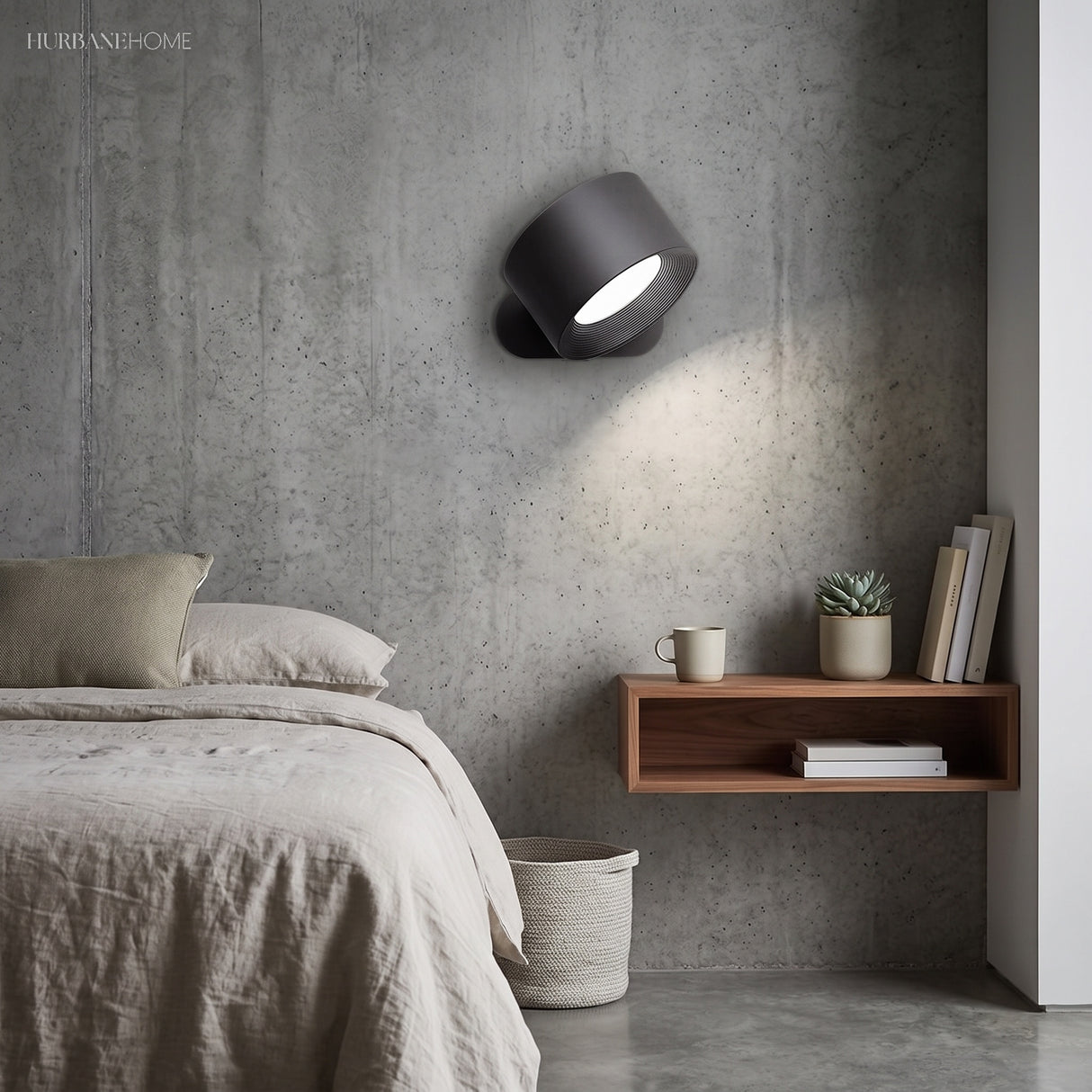 Black battery operated wall light mounted beside a bed as a reading light