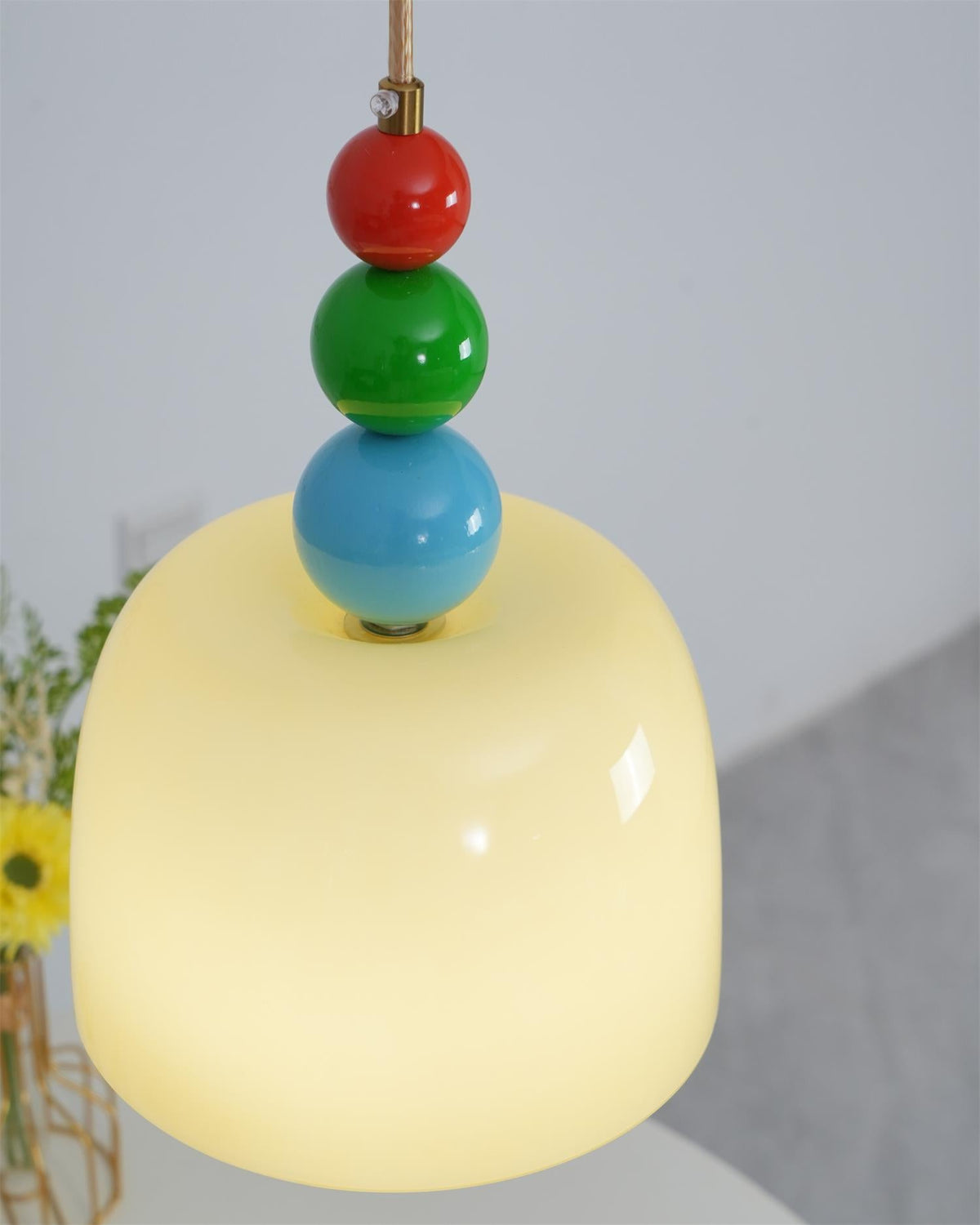 Close view of the glass dome lit from inside with the blue bead above it