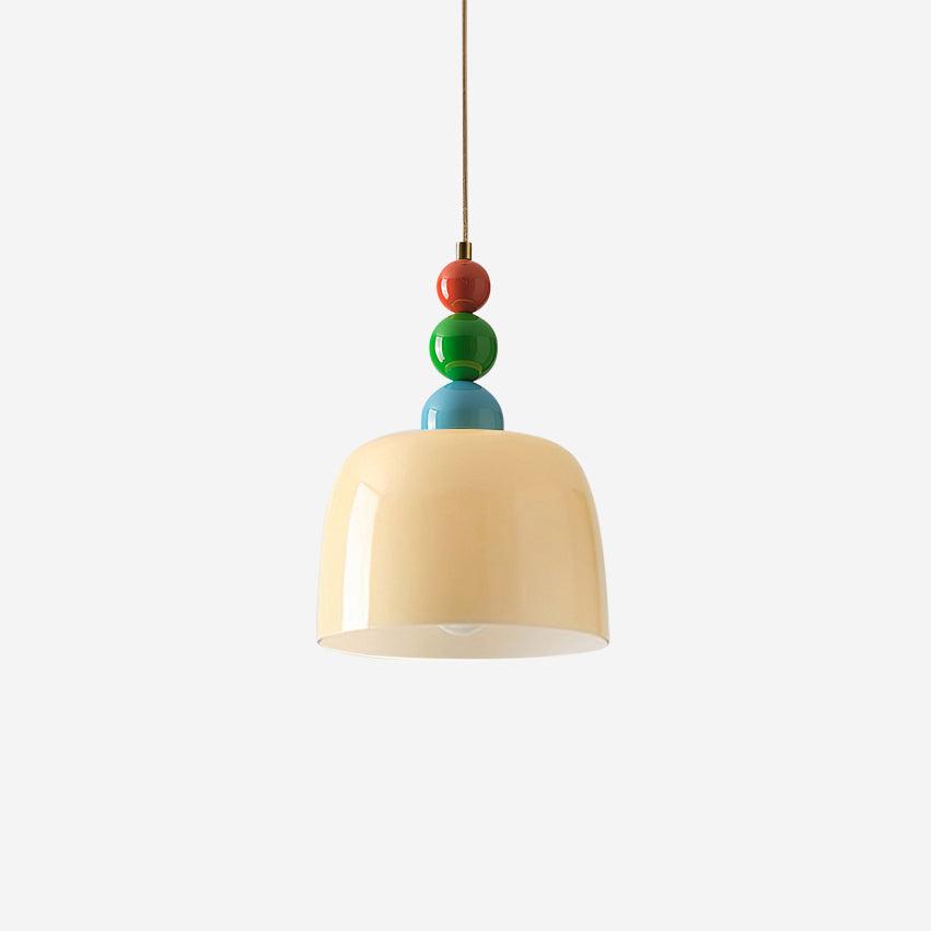 Studio view of the beige glass dome shade below three stacked painted beads