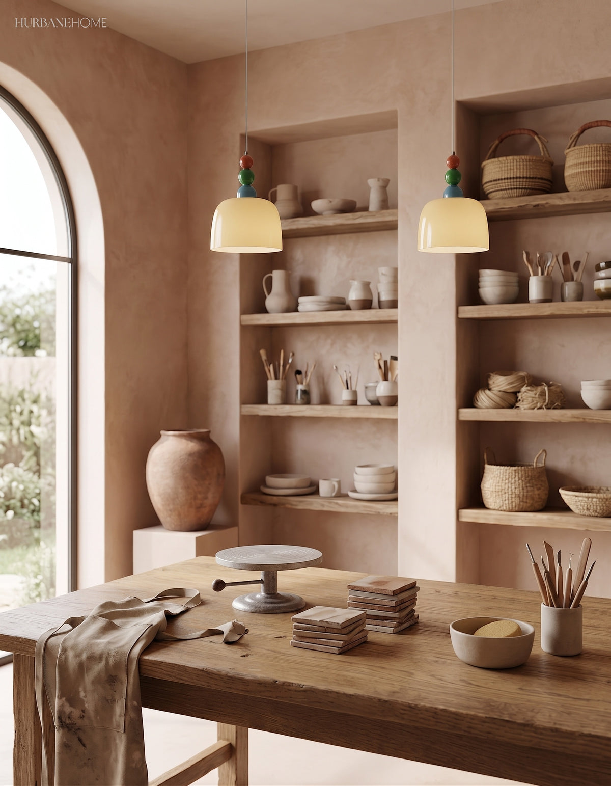 Two beaded glass pendants above a shelved dining room with an arched window