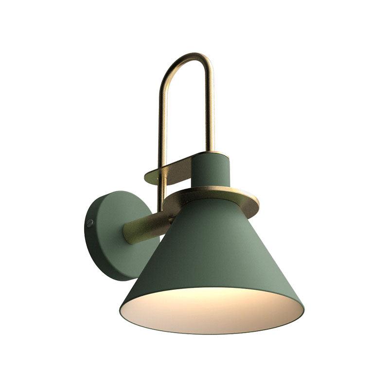 Green cone sconce lit warm and shown against a plain background