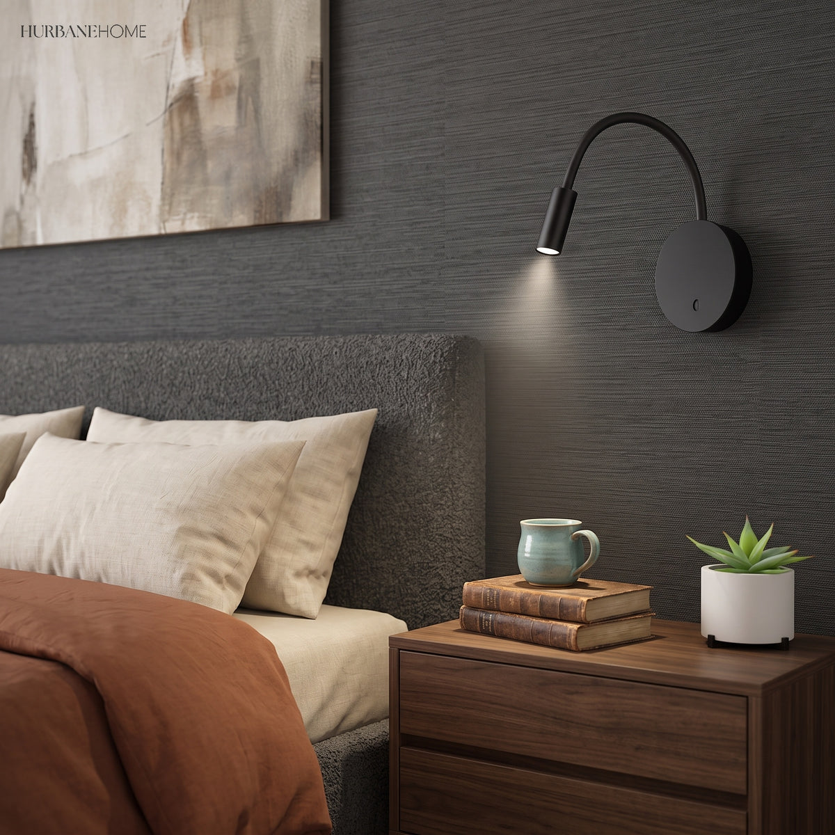 Black reading light lit on a dark wall above a bedside table