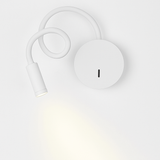 White reading light seen from above with the beam on the wall