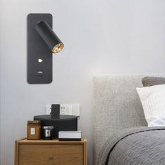 Black bedside reading light mounted above a wooden bedside table