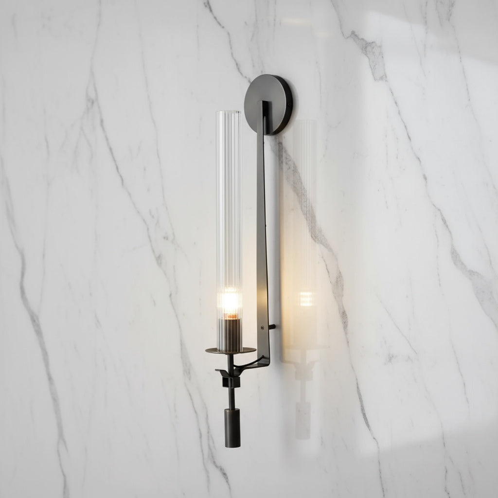 Black fluted glass sconce mounted on a white marble wall