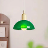 Beige glass bowl pendant light with a matching neutral metal cap