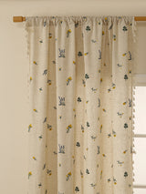 Rustic linen window drapery softly filtering sunlight with decorative fringe