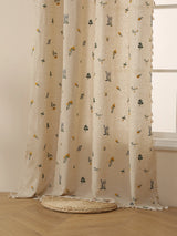 Beige linen window panel with soft fringe and gentle daylight filtering