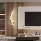 Warm arc wall light in a beige wabi-sabi living room setting