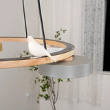 Bird chandelier with macaron LED shades highlighting the warm timber tone of the ring
