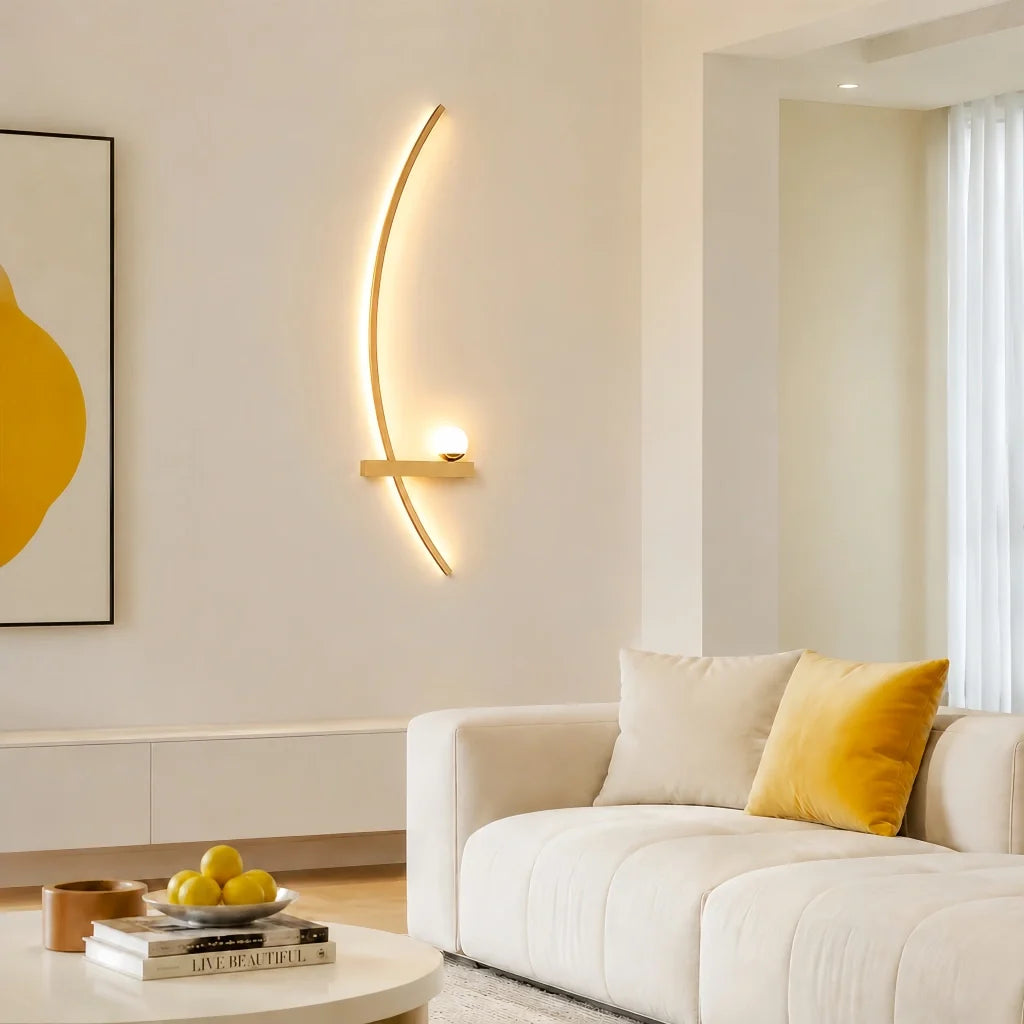 Black curved linear wall light lit warm on a textured plaster wall
