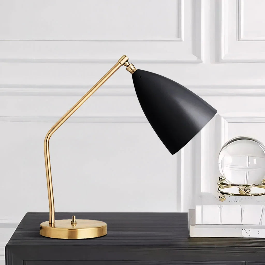 Black conical shade brass table lamp studio shot