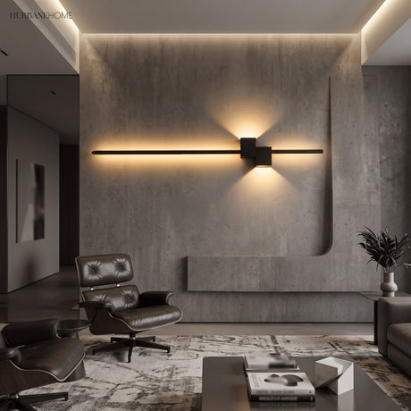 Black LED wall sconce on concrete wall in a modern lounge