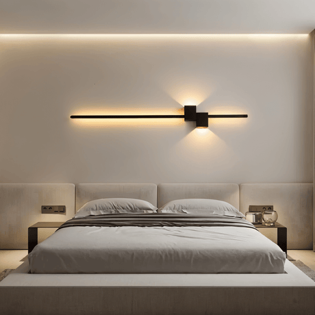 Black minimalist LED wall sconce packaged with mounting hardware