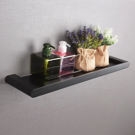 stainless steel shower rack mounted on bathroom wall