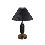 Black pleated table lamp with brass base, product view