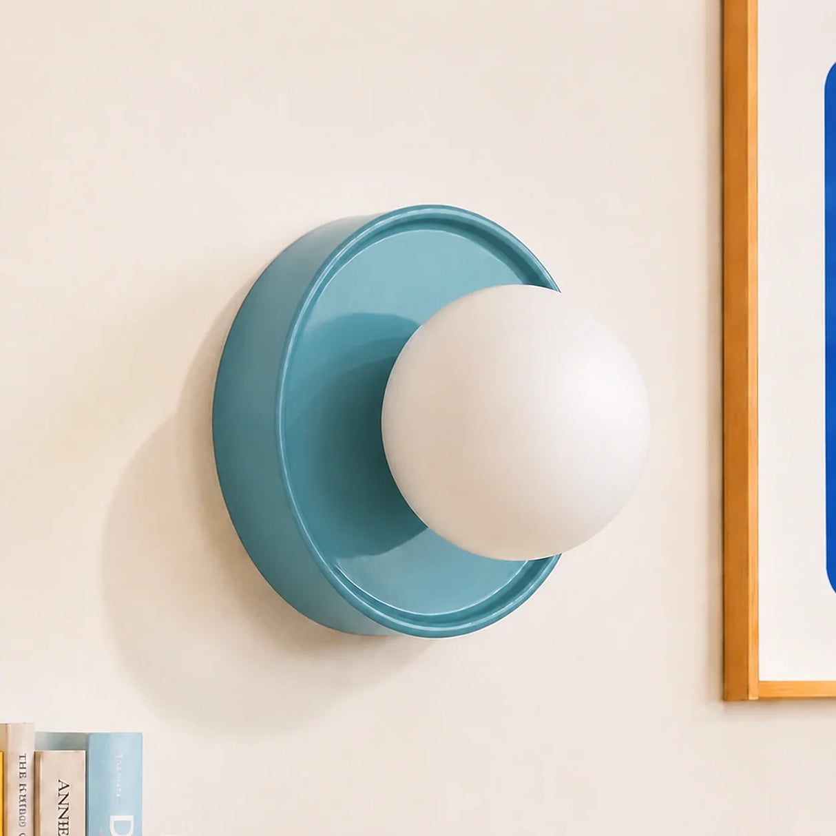 Blue ceramic orb wall sconce shown straight on against a plain background