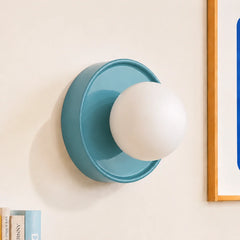 Blue ceramic orb wall sconce shown straight on against a plain background