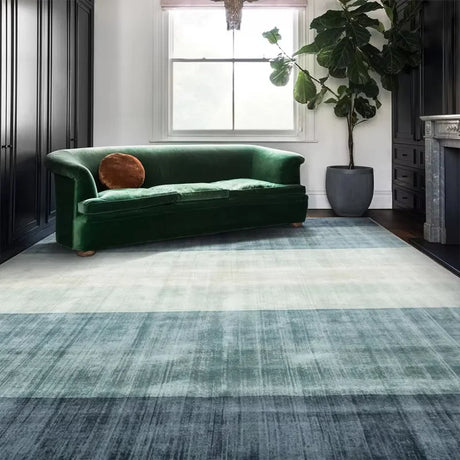 Blue gradient rug creating soft visual flow in living room interior