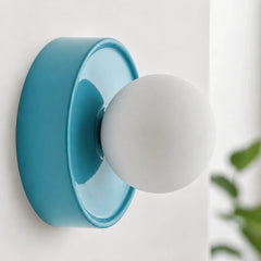 Blue orb wall sconce rear view showing the round mounting plate