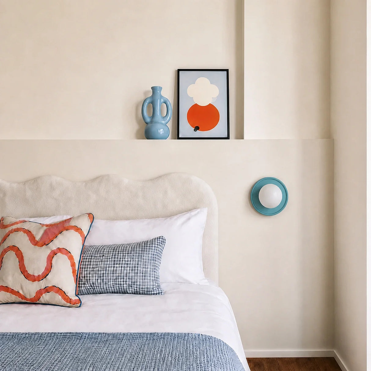 Blue orb wall sconce viewed from the side showing its shallow depth