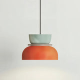 Light blue and orange bowl pendant light on a clean studio-white background