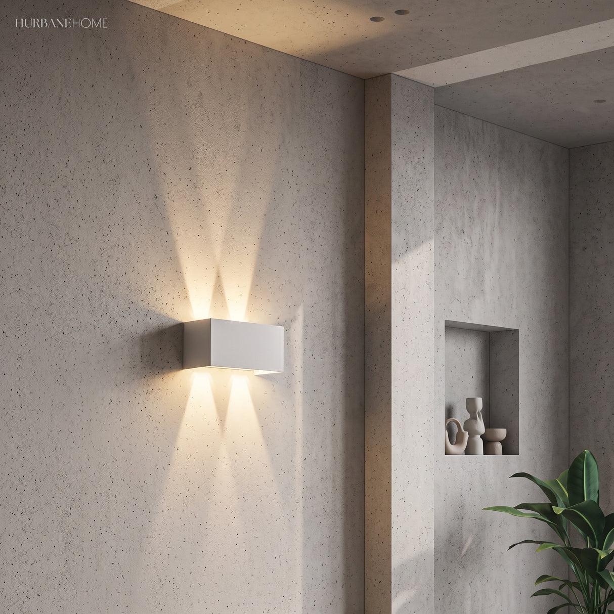 White up and down LED wall sconce beside a concrete wall niche