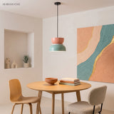 Colourful bowl pendant light in a warm dining nook