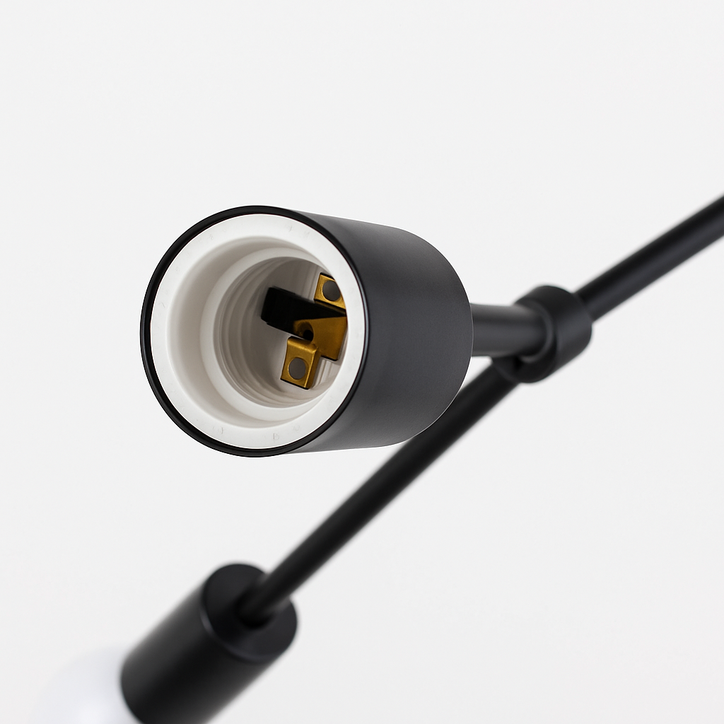 Close view of one bare lamp holder on a black arm