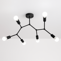 Black six light branch fixture spread across a white ceiling