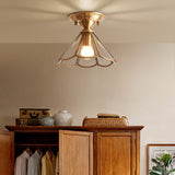 Flared glass panel ceiling light lit above a timber wardrobe