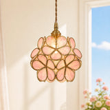Angled studio shot of the brass and glass flower petal pendant light