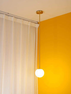 Brass rod pendant light with a 3.6 inch opal glass globe, view 11