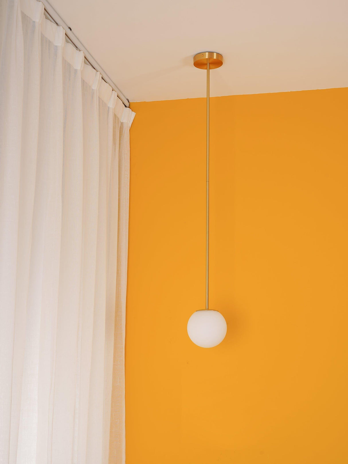 Modern globe pendant light on a rigid stem for kitchen islands, view 12