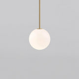 Opal glass globe pendant on a rigid brass stem, gold finish, view 19