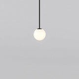 Opal glass sphere pendant on a slim vertical metal stem, view 22