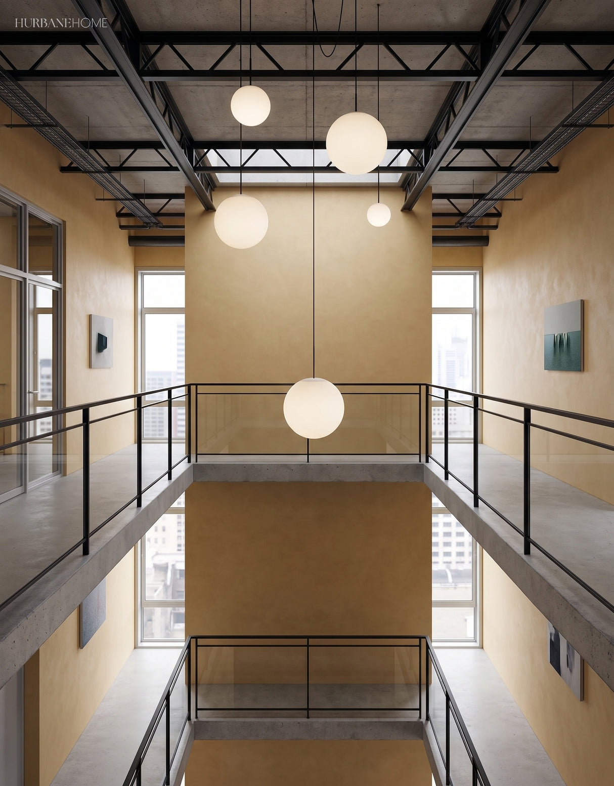 Brass stem globe pendants at varied heights in a double height atrium