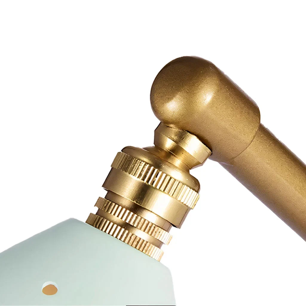 Brass table lamp shade and arm joint detail