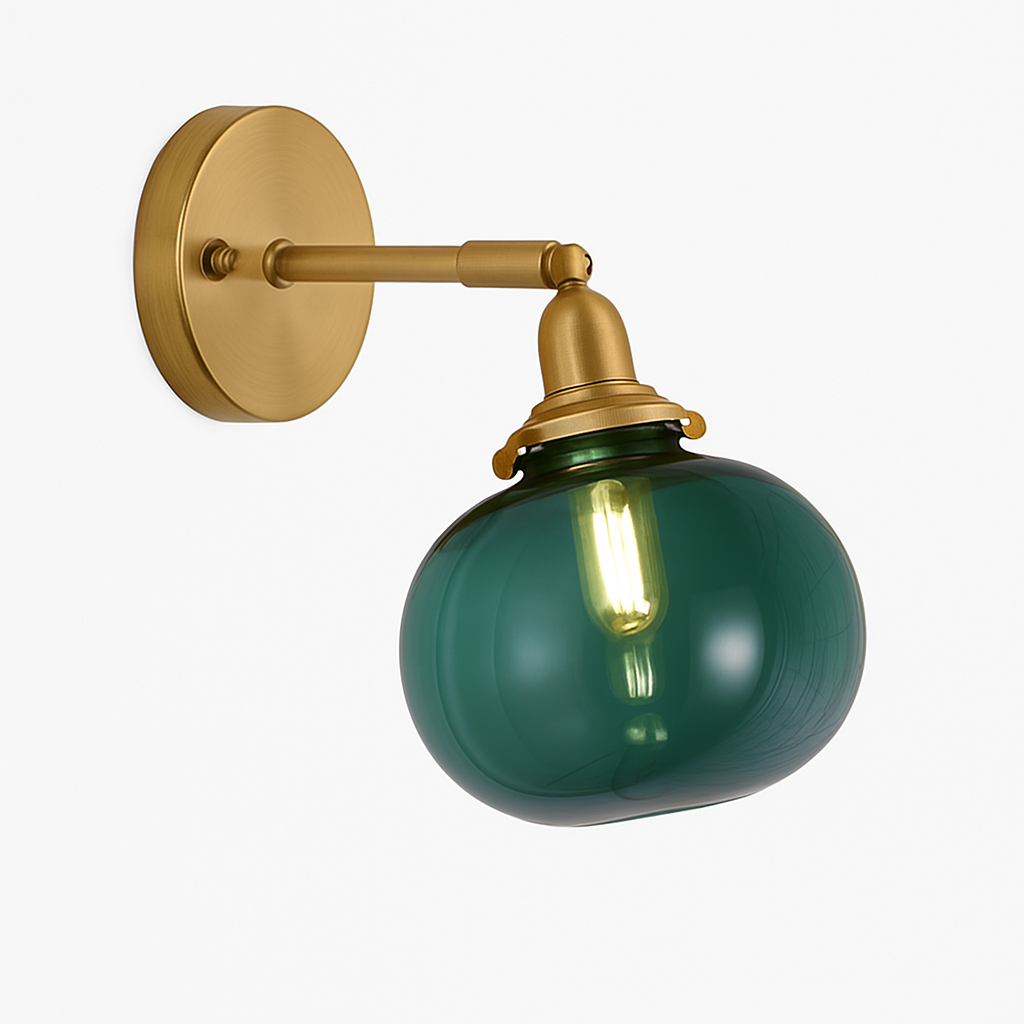 Brass wall sconce holding a smooth dark green glass shade