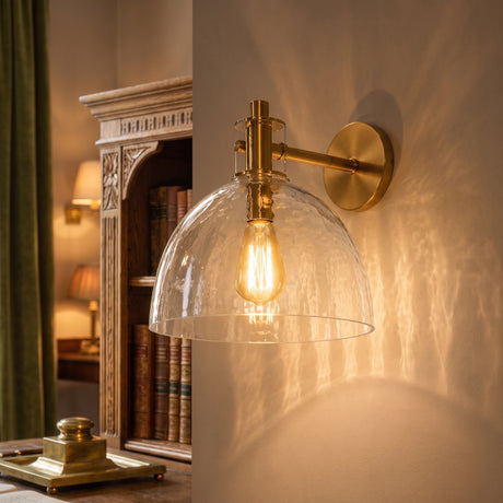 Brass seeded glass dome sconce main product image on a plain background