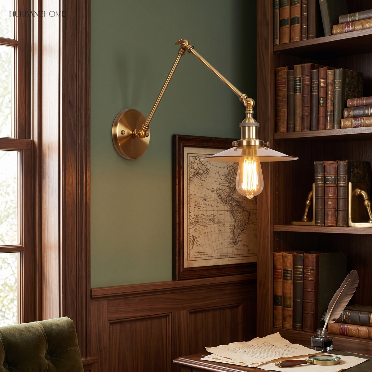 Brass sconce with a flat disc shade above a study writing desk