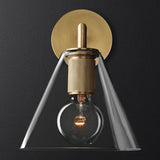 Clear glass cone shade sconce lit against a charcoal background