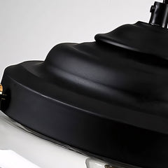 Detailed close-up of the black stepped metal cap crowning the clear glass pendant fixture
