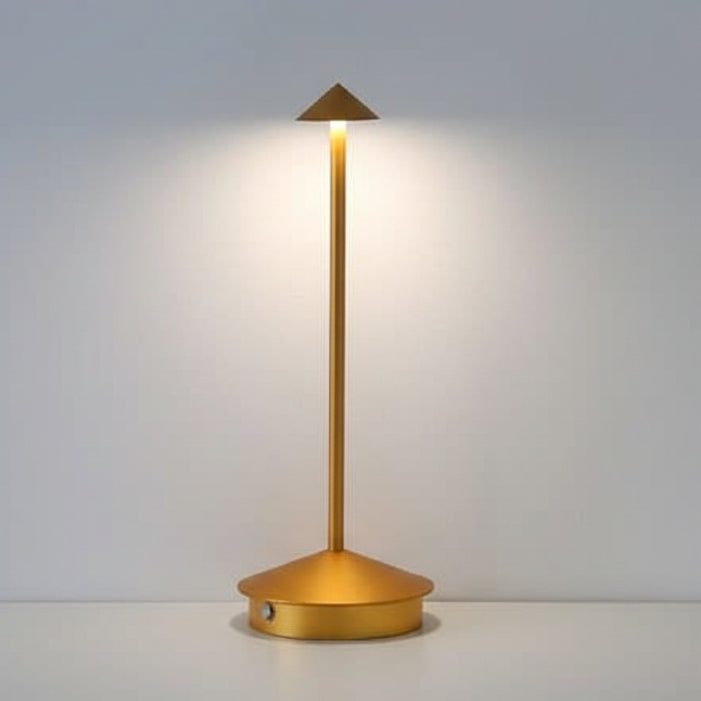 Gold cordless table lamp close up showing the polycarbonate shade